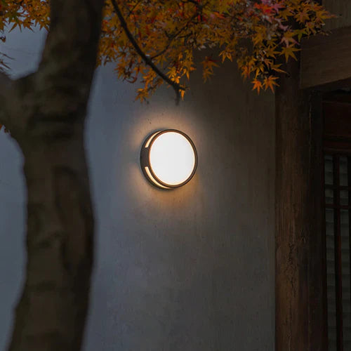 Round Outdoor LED Wall Light Modern Metal Design | Quorix